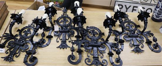 A set of four Spanish black japanned wrought iron wall sconces, H 45cm (max)